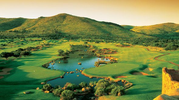 The picturesque Lost City Golf Course at Sun City, showcasing its signature water features and vibrant terrain in South Africa.